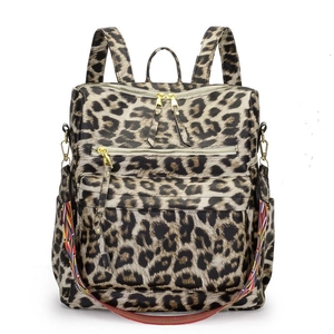Sac à dos mode imprimé léopard avec zips dorés et bandoulière tissée colorée