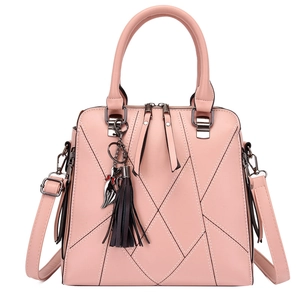 Pink PU leather tote bag with geometric stitching, tassel charm, and adjustable strap