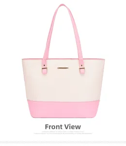 Front view detail of pink and white paneled tote bag with golden hardware accents