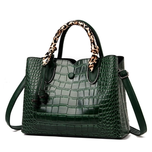 Dark green crocodile pattern handbag with leopard print scarf and top handle