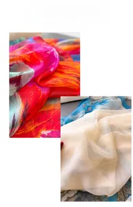 Detailed view of lightweight printed silk scarf with vibrant feather patterns and sheer fabric