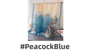 Close-up of peacock blue floral print on semi-transparent long silk shawl