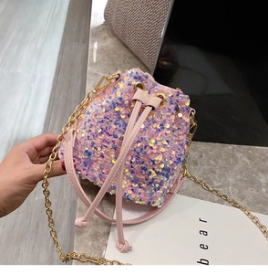 Close-up of pink sequin bucket bag with iridescent laser scales and gold chain