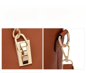 Détail d'un sac à main marron avec fermoir en métal doré et attaches en anneau en D