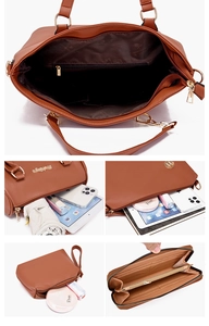 Détail intérieur du sac en cuir marron montrant les compartiments et la poche zippée