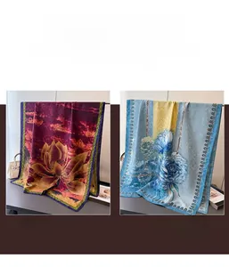 Detailed close-up of blue floral silk scarves and golden lotus patterned shawls