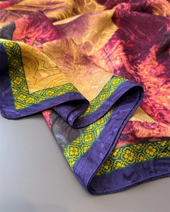 Close-up of silk scarf with vintage floral patterns and luxurious metallic textures