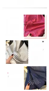 Detailed view of silk-like polka dot scarves showing fine printing and hemmed edges