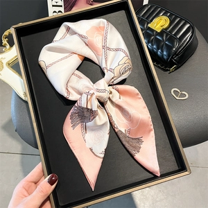 Elegant floral faux silk scarf with pink roses and rope pattern on a luxury tray