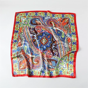 Luxurious satin paisley square scarf with vibrant red border and silky finish for women