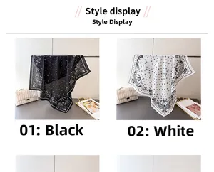 Detail view of black and white paisley bandanas with star patterns on display