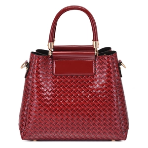 Large burgundy woven shoulder bag with glossy patent leather trim and gold hardware