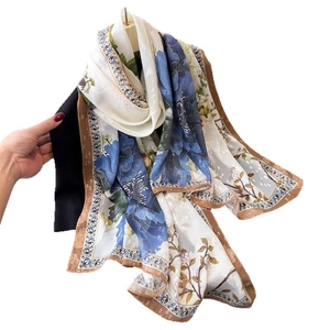 Floral print silk scarf with blue peony pattern and retro vintage border design