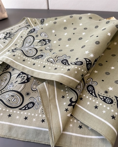 Detail of olive green paisley and star pattern on lightweight cotton square scarf