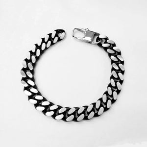Close-up of black and silver cuban link chain bracelet with lobster clasp for men
