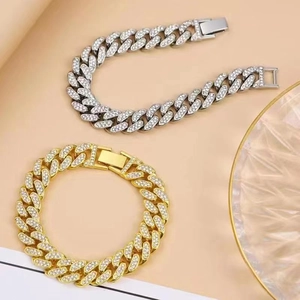 Close-up of hip-hop cuban chain bracelets with pavé diamonds in gold and silver finish