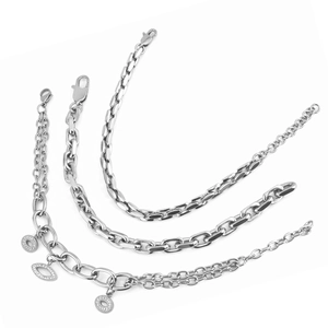 Detailed view of silver stainless steel chain set with evil eye and ring pendants