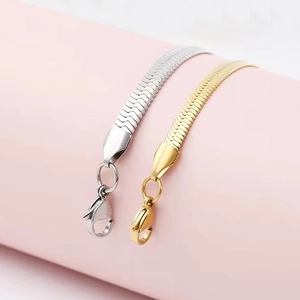 Flat herringbone snake chain bracelet in gold and silver finishes with lobster clasp detail