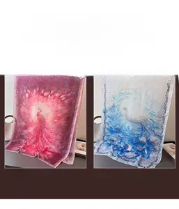 Detail of red and blue peacock pattern printed silk scarves with elegant floral texture