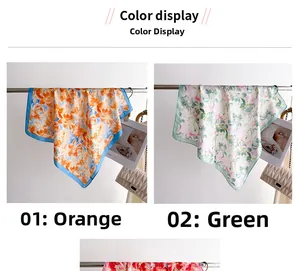 Vue détaillée de foulards en soie floraux orange et vert sur un cintre métallique