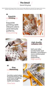 Detail of silk satin scarf featuring tropical plants, leopard print and fine hemmed edges