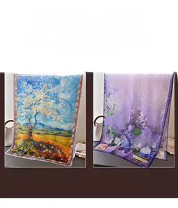 Close-up of lightweight floral and landscape print silk scarves with premium textures