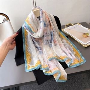 Elegant floral print long silk scarf with blue borders and yellow classical patterns