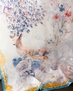 Macro shot of forest deer print on translucent floral silk scarf with jacquard texture