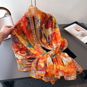 Elegant orange silk scarf with artistic deer print and vintage geometric borders
