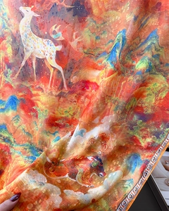 Detail of artistic chiffon scarf with colorful Chinese mythical deer print and sheer fabric