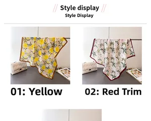 Detail view of yellow floral and red bordered patterned silk scarves displayed together