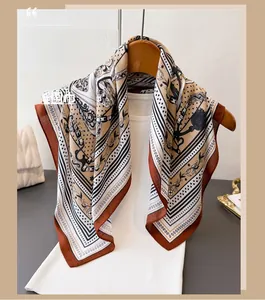 Detail of multi-color printed scarf with chain patterns on a clothing hanger
