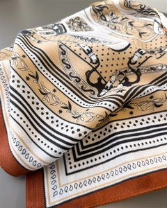 Detailed close-up showing retro chain patterns and twill texture on a brown square scarf