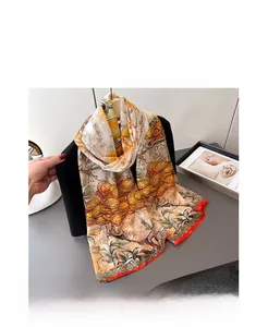 Close-up of floral print silk scarf styled on a black blazer with artistic warm tones