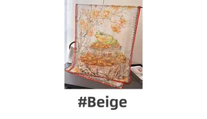 Detail of beige silk scarf with traditional frog and floral print and red piped edges