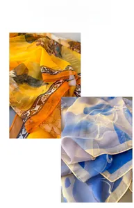 Close-up of lightweight gradient scarves with floral and abstract ink prints