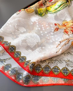 Detailed close-up of semi-transparent floral silk scarf with traditional Chinese patterns