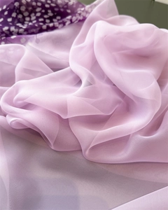 Close-up of lightweight lavender gradient scarf with sheer floral pattern and soft drapes