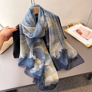 Elegant floral print long scarf in blue and yellow silk-like fabric for sun protection