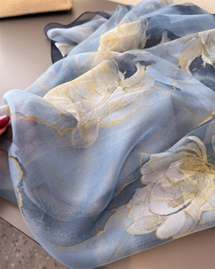 Detail shot of the lightweight floral chiffon scarf showing edge stitching and texture