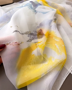 Detailed macro view of lightweight floral printed chiffon scarf showing sheer fabric texture