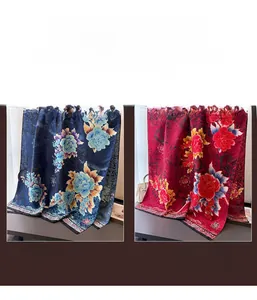 Macro detail of silk scarf featuring colorful peony floral prints and calligraphy patterns