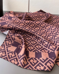 Macro detail of the silk scarf texture showing the luxury double F monogram pattern