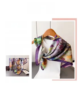 Detail of oil painting style silk scarf with purple border and vintage floral patterns