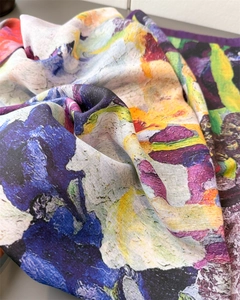 Detailed macro view of oil painting style flower print on herringbone twill silk scarf