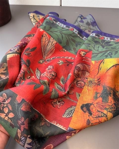 Detailed view of silk scarf with dragonfly prints and traditional Chinese lady patterns
