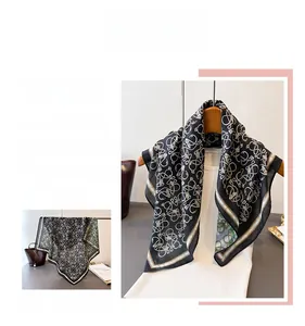 Detail of elegant herringbone silk scarf featuring dual-color geometric chain patterns
