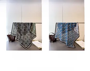 Detail of premium silk scarf featuring classic double-sided herringbone and vintage horse patterns