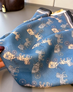 Detailed view of Morandi blue herringbone silk scarf featuring classic carriage patterns
