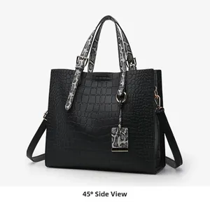 Detail of black crocodile texture tote bag with stylish snake pattern handles in 45-degree view